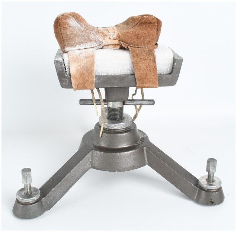 Herter's Adjustable Cast Iron Benchrest Shooting Stand: This is a heavy-duty adjustable benchrest shooting stand manufactured by Herter's of Waseca, Minnesota, designed as a vintage style shooting bench rest made of solid heavy cast iron. The unit features