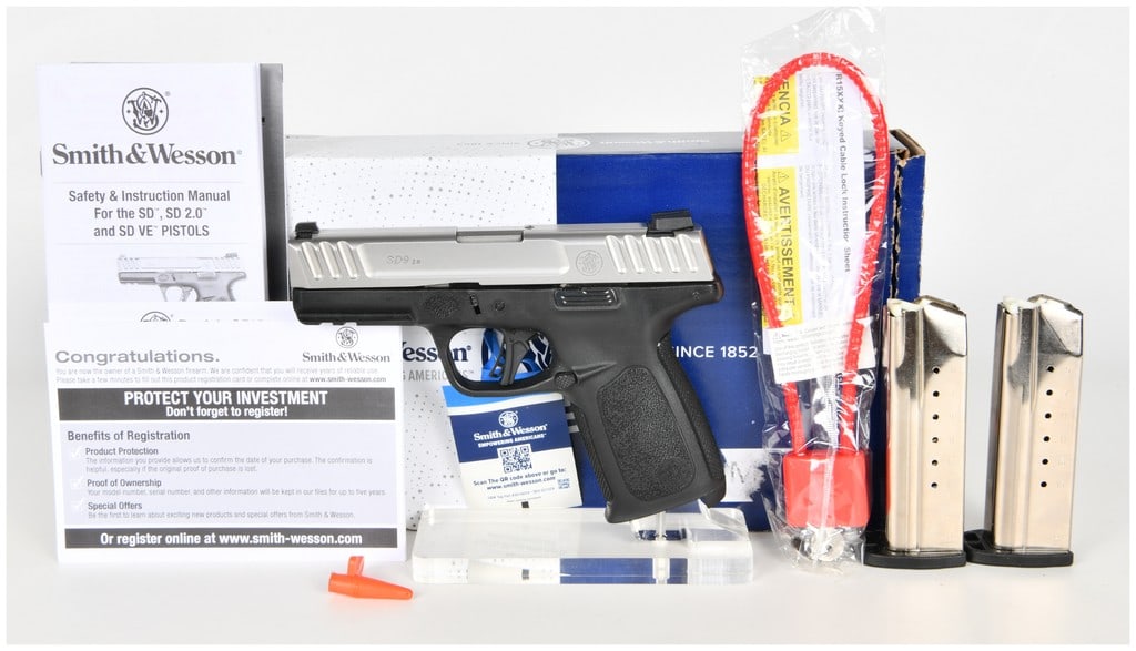 Smith & Wesson SD9 2.0 Semi-Automatic Pistol 9mm with 4 Inch Barrel: This Smith & Wesson SD9 2.0 is a semi-automatic striker-fired pistol chambered in 9mm Luger, featuring a 4 inch barrel and a two-tone aesthetic. The firearm is constructed with a stainless steel slide