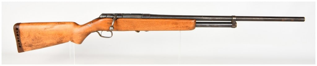 Sears Ranger Model 105-20 Bolt Action Shotgun 16 Gauge: This is a Sears Ranger Model 105-20 bolt-action shotgun chambered in 16 gauge, featuring an under-barrel tubular magazine. The firearm is constructed with a blued steel barrel and receiver mounted to 