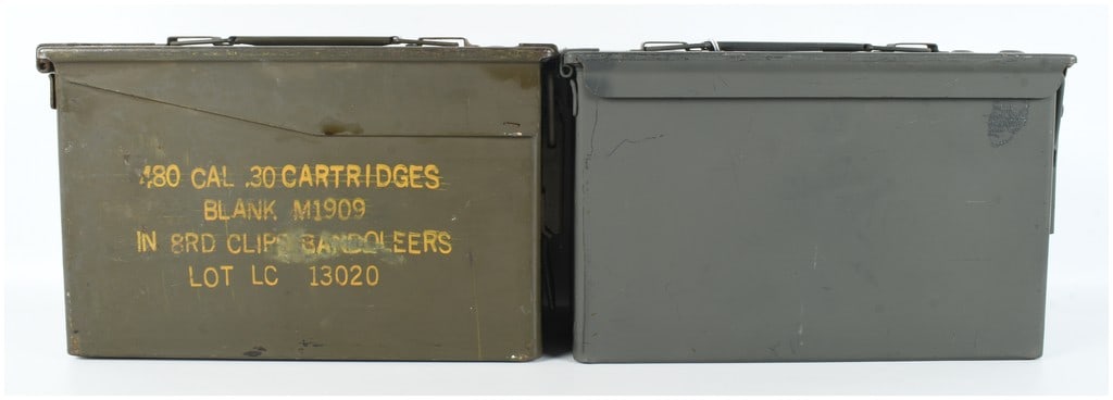 Two US Military M2A1 and .30 Caliber Steel Ammunition Cans: This lot consists of two US military steel ammunition storage containers finished in olive drab green. The first can is a .30 caliber style container. The front face features stenciled yellow letterin