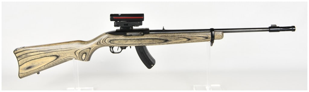 Ruger Model 10/22 Carbine Semi-Automatic Rifle .22 LR with 18.5 Inch Barrel 1976: This Ruger Model 10/22 Carbine is a semi-automatic rifle chambered in .22 Long Rifle designed for versatile rimfire applications. It features a standard 18.5 inch carbine-length barrel equipped with a