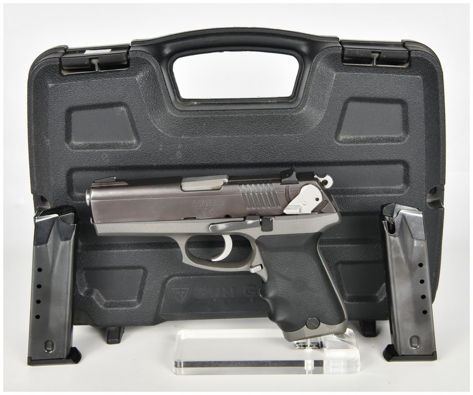 Ruger P94 Semi-Automatic Pistol .40 Auto with 4.2 Inch Barrel: This is a Ruger P94 semi-automatic, hammer-fired pistol chambered in .40 Auto. The firearm features a two-tone aesthetic with a dark-finished slide and a matte gray aluminum alloy frame. The barrel me