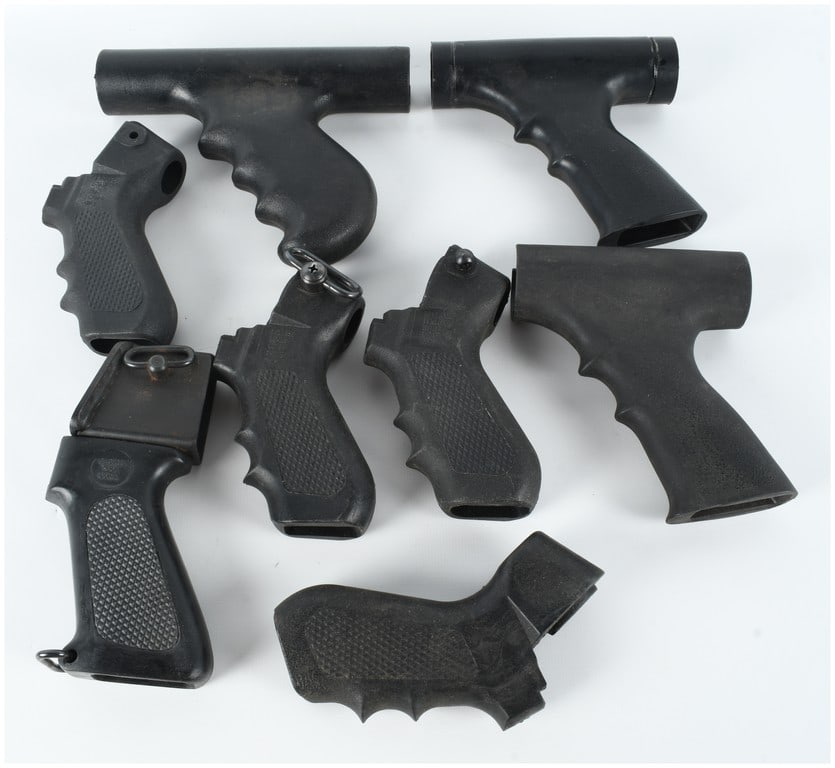 A Collection of 8 Assorted Polymer Shotgun Pistol Grips and Folding Stock Components: This collection consists of eight (8) assorted black polymer firearm accessories, primarily configured as rear pistol grips and folding stock components intended for use with pump-action shotguns such
