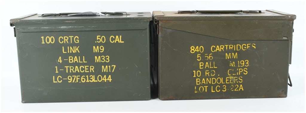 A Pair of US Military M2A1 Steel Ammunition Cans: Two United States military surplus M2A1 steel ammunition boxes, commonly designated as 50 caliber size containers. Each box is constructed of heavy-gauge steel with a top-opening lid, a rubber gasket 