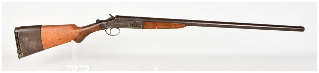 W.H. Davenport Fire Arms Co. Side-Lever Break-Action Shotgun with 30 Inch Barrel: This is a single-shot, break-action shotgun manufactured by the W.H. Davenport Fire Arms Co. featuring a 30 inch barrel and an external hammer. The firearm utilizes a side-lever release mechanism loca