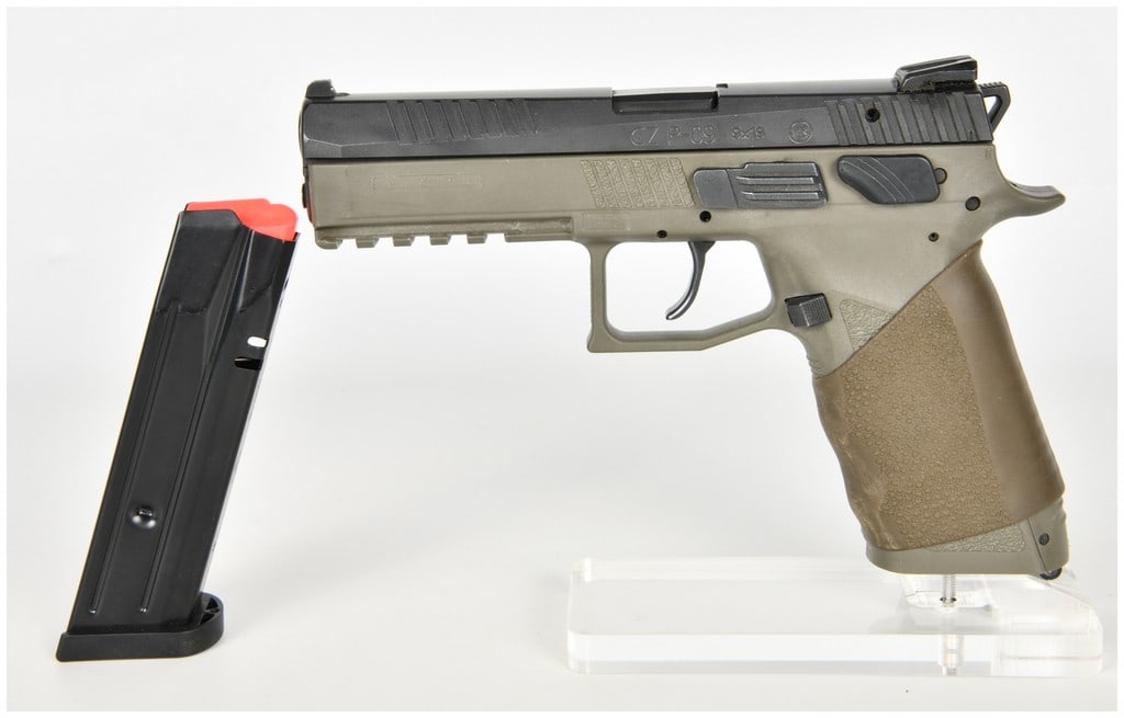 CZ P-09 Semi-Automatic Pistol 9x19mm with 4.54 Inch Barrel: This is a full-sized CZ P-09 semi-automatic hammer-fired pistol chambered in 9x19mm, featuring a 4.54-inch barrel and a distinctive two-tone configuration. The firearm is constructed with a matte blac