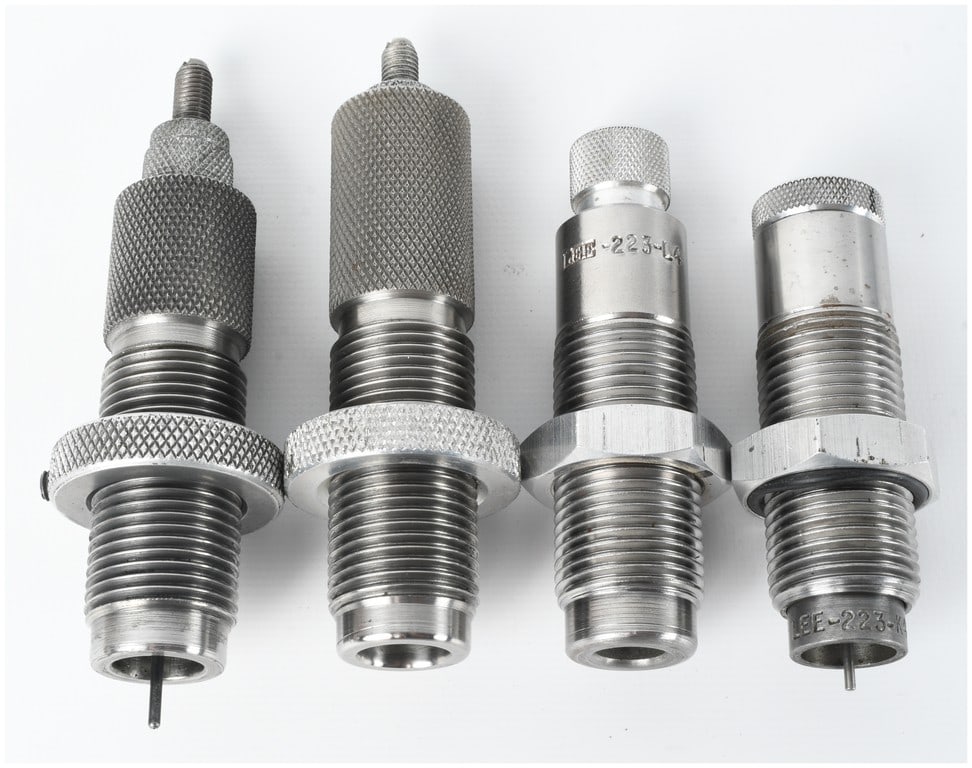 A Group of Four Assorted Reloading Dies: A group of four assorted metal reloading dies for ammunition, containing various styles and calibers. From left to right, the first item is a full-length sizing die featuring a knurled body and lockin