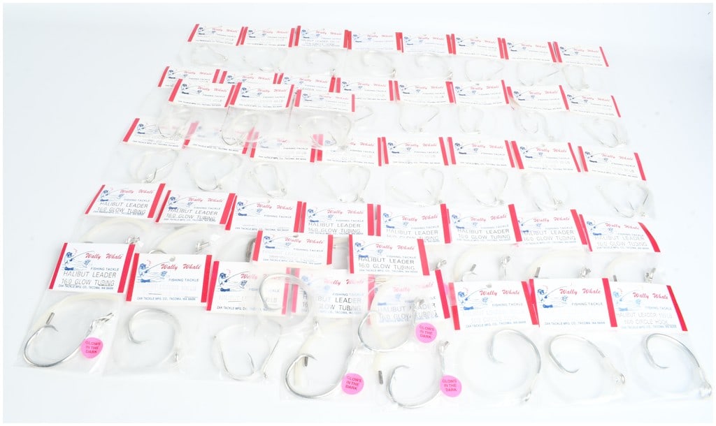 44 Wally Whale Saltwater Fishing Hooks and Halibut Leaders: This lot consists of 44 saltwater fishing hooks and halibut leaders manufactured by Zak Tackle Mfg. Co. under the Wally Whale brand. The assortment is presented in original clear plastic retail packag