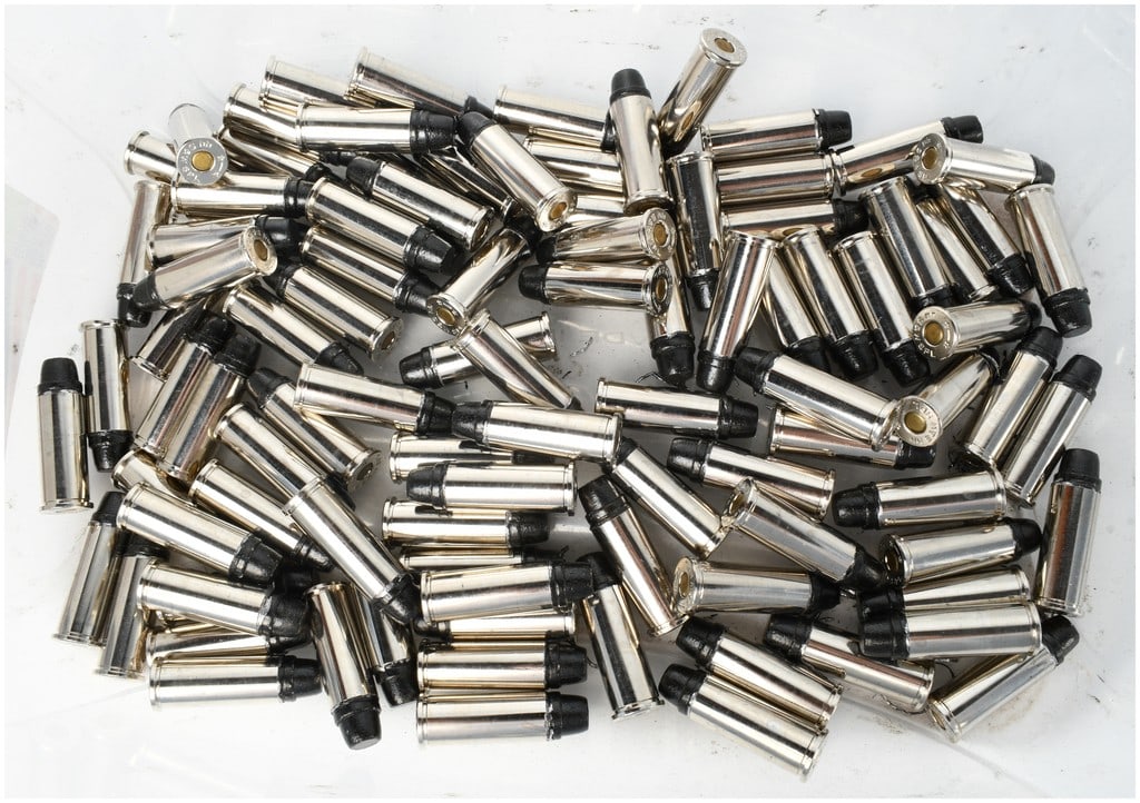 A Lot of 100 Rounds of Underwood .44 S&W Special Ammunition: This lot consists of 100 rounds of .44 S&W Special ammunition featuring nickel-plated cases and black-coated projectiles. Based on the specific combination of components and appearance, these cartridg