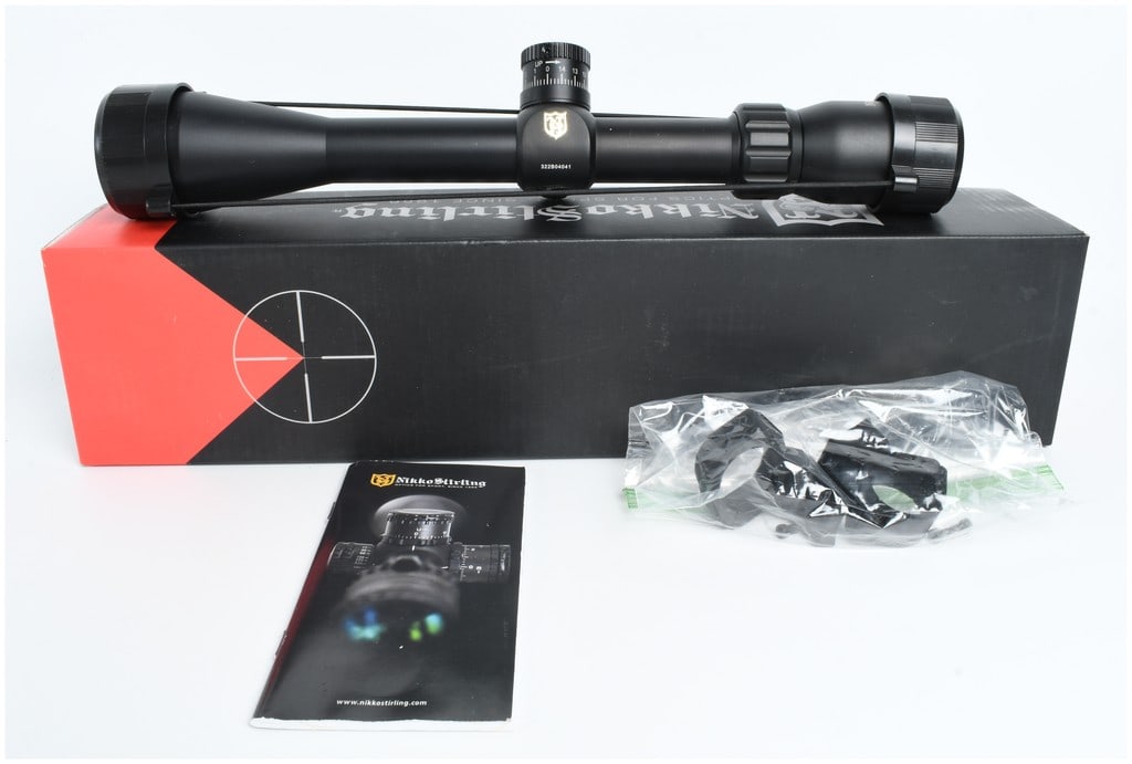 Nikko Stirling Game Pro 4-12x40 Rifle Scope with Target Turret: A Nikko Stirling Game Pro 4-12x40 rifle scope featuring a matte black finish, a half mil dot reticle, and a target turret. The objective bell is inscribed NIKKO STIRLING GAMEPRO 4-12X40, and the ocula