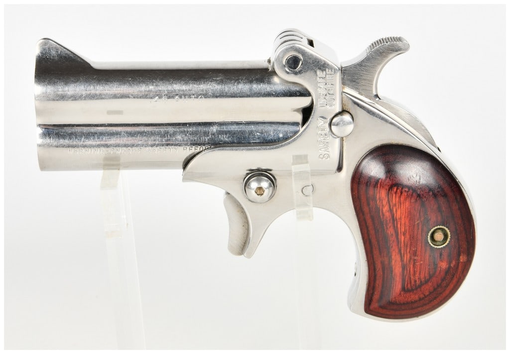 American Derringer Corp. Model M-1 Break Action Over/Under Derringer .45 Auto with 3 Inch Barrel: This is an American Derringer Corp. Model M-1 over/under break-action derringer chambered in .45 Auto. The pistol features 3-inch barrels with a bright, polished stainless steel finish throughout the 