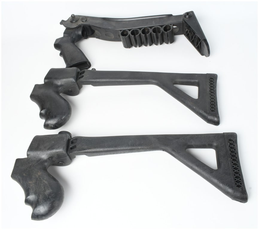 Three Tactical Shotgun Stocks Including Choate Top-Folding Model: This lot consists of three tactical shotgun stock assemblies primarily constructed from molded black polymer with metal hinges and mounting hardware. The first item is a top-folding shotgun stock mark