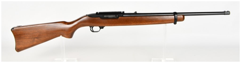 Ruger Model 10/22 Carbine Semi-Automatic Rifle .22 LR with 18.5 Inch Barrel: This is a semi-automatic Ruger Model 10/22 Carbine chambered in .22 Long Rifle featuring an 18.5 inch blued steel barrel and a black-finished receiver. The rifle is fitted with a smooth