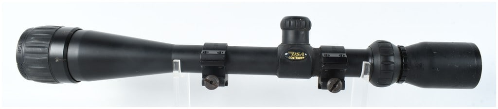 BSA Contender 8-32x40 Variable Power Rifle Scope with Kwik-Site Rings: This BSA Contender rifle scope features a variable magnification range from 8x to 32x with a 40mm objective lens. The body is constructed with a matte black finish. The turret housing is labeled with 