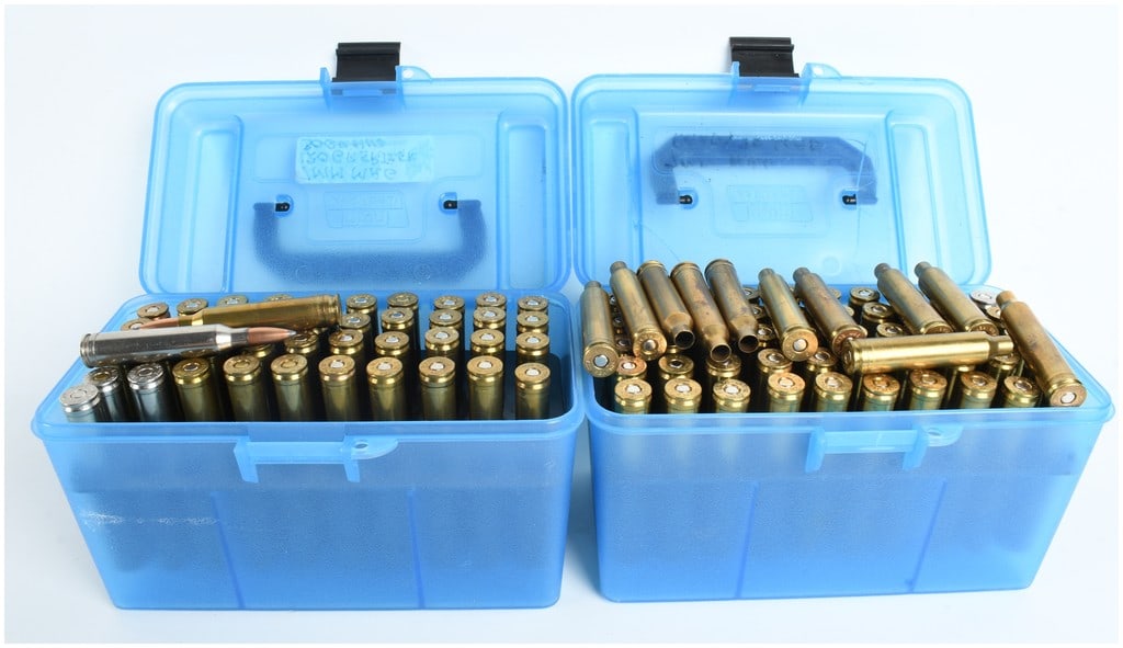 A Lot of 104 7mm Remington Magnum Live Rounds and Primed Brass Casings: This lot comprises a total of 104 pieces of 7mm Remington Magnum ammunition and reloading components, consisting of 43 live rounds and 61 empty and primed brass casings. The collection is housed in tw