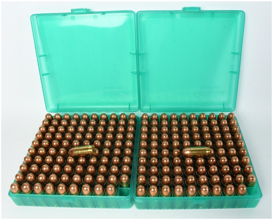 A Lot of 200 Rounds of .45 ACP Centerfire Handgun Ammunition: This lot consists of 200 rounds of .45 ACP centerfire handgun ammunition, contained within two translucent green plastic 100-round flip-top storage boxes. The ammunition is configured with brass casin