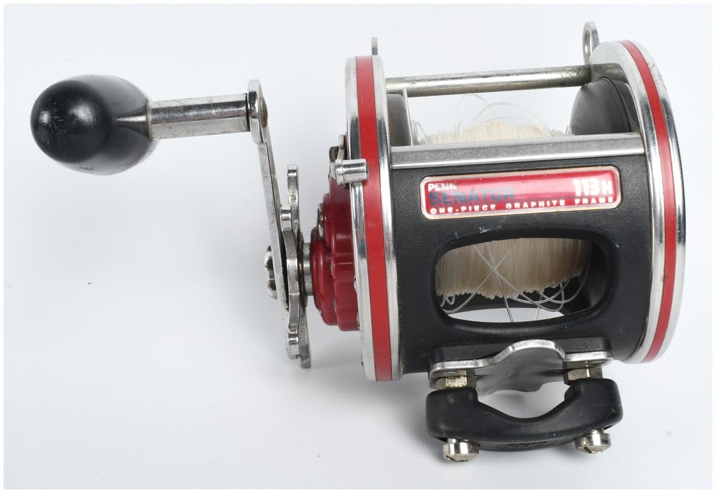 Penn Special Senator 113H 4/0 High Speed Salt Water Trolling Reel: This Penn Special 4/0 Senator 113H high-speed conventional salt water trolling reel features a black one-piece graphite frame and red side plates. The side plate is embossed with a leaping billfish an