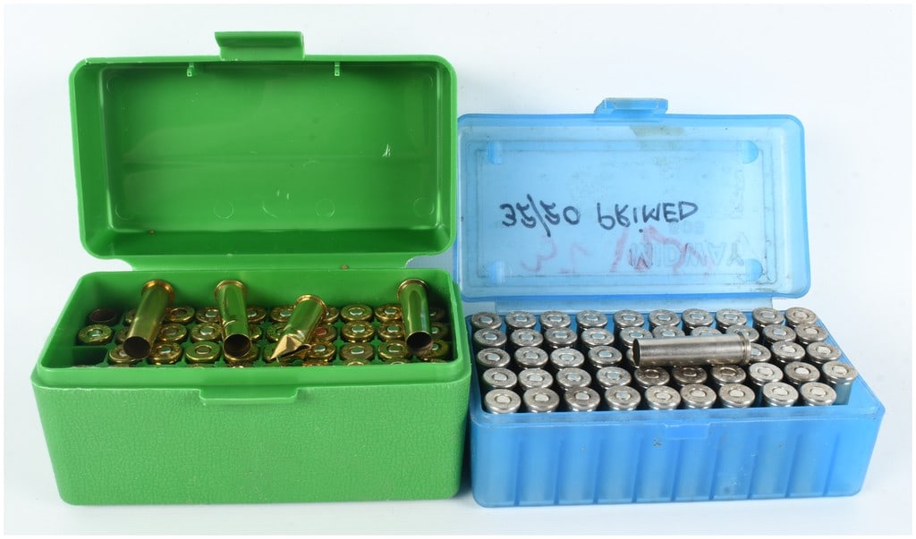 A Lot of 103 Pieces of .32-20 Winchester Primed Ammunition Casings: This lot comprises a collection of 103 pieces of .32-20 Winchester caliber primed ammunition casings intended for reloading. The collection is divided between 52 brass-finished casings and 51 nickel-p