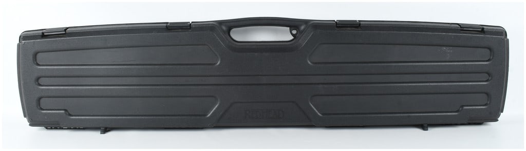 RedHead Hard-Sided Polymer Long Gun Case: A single hard-sided long gun case manufactured by RedHead, designed for the secure transport and storage of a rifle or shotgun. The case is constructed from durable molded black polymer with horizonta