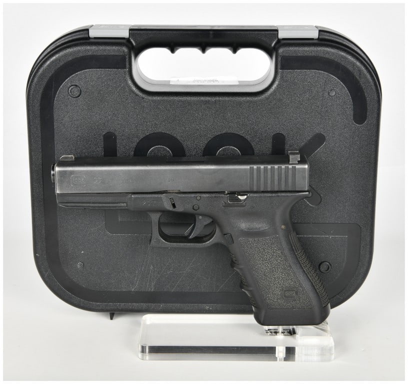 Glock Model 22 Semi-Automatic Pistol .40 S&W with 4.49 Inch Barrel: A Glock Model 22 semi-automatic pistol chambered in .40 S&W designed for duty and self-defense applications. This firearm features a 4.49 inch barrel housed within a matte black finished steel slide, 