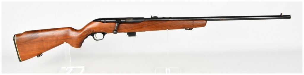Mossberg Model 340KA Bolt Action Rifle .22 S-L-LR with 24 Inch Barrel: This is a Mossberg Model 340KA bolt-action rifle chambered for .22 Short, Long, or Long Rifle cartridges. It features a blued metal finish and a 24-inch barrel with Mossbergs AC-KRO-GRUV rifling. The 