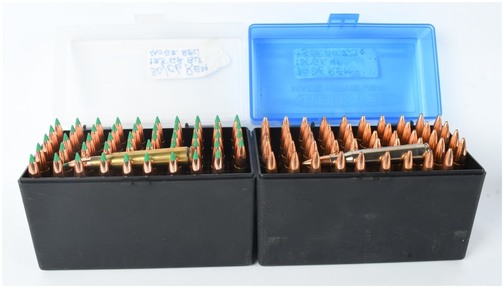 A Lot of 100 Live Hand Loaded .30-06 Springfield Rifle Cartridges: This lot consists of 100 live rounds of hand-loaded .30-06 Springfield caliber rifle ammunition, organized into two black plastic flip-top storage boxes manufactured by MTM Case-Gard. The first box co
