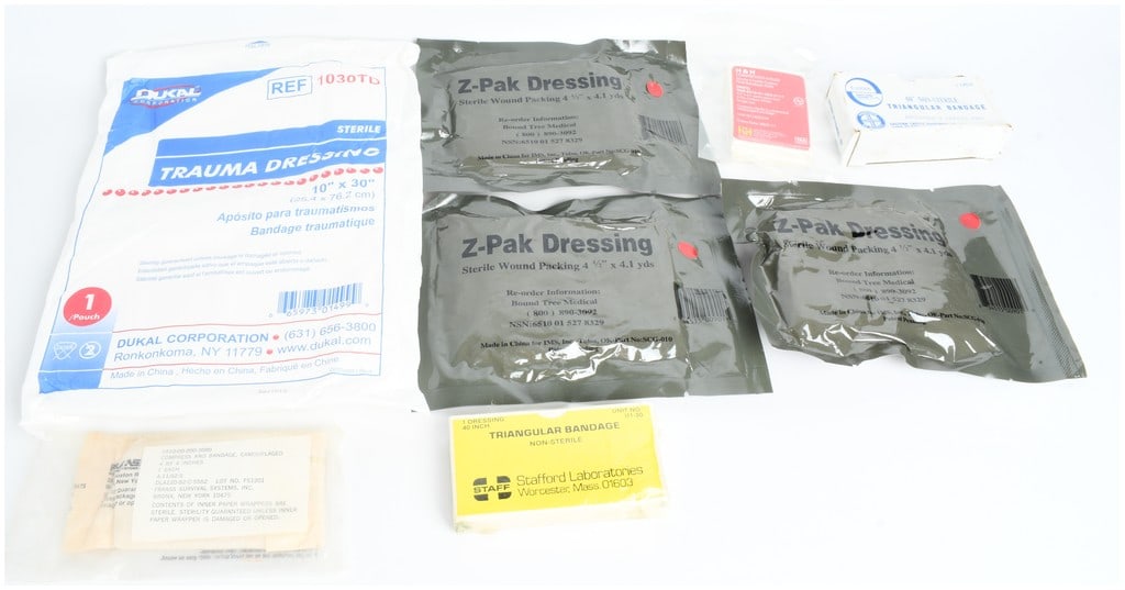 A Collection of Eight United States Military Specification and Tactical Medical Field Dressings and (1 of 6)