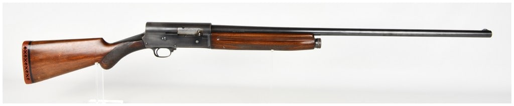 Browning Auto-5 Semi-Automatic Shotgun 12 Gauge with 31 Inch Barrel: This is a Belgian-manufactured Browning Auto-5 semi-automatic shotgun chambered in 12 gauge, specifically designed for 70mm (2 3/4 inch) shells. The firearm features a 31-inch barrel constructed of sp