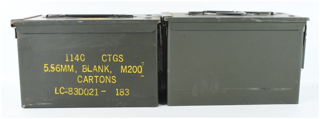 A Pair of US Military M2A1 Steel Ammunition Cans: This is a pair of United States military M2A1 steel ammunition containers, often referred to as .50 caliber size cans. Both items are constructed from heavy-gauge steel with integrated folding carry h