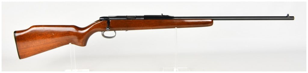 Remington Model 581 Bolt Action Rifle .22 Short, Long, or Long Rifle: This is a Remington Model 581 bolt-action rimfire rifle chambered for .22 Short, Long, or Long Rifle cartridges. The firearm is equipped with a blued steel barrel and receiver mated to a smooth wood s