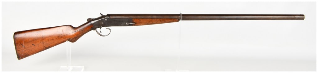 Iver Johnson Champion Break Action Shotgun 12 Gauge with 30 Inch Barrel: This is a single-shot break-action shotgun manufactured by Iver Johnson's Arms & Cycle Works, featuring a 30 inch barrel equipped with a bead front sight. The firearm utilizes a side-lever release and