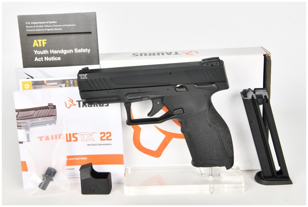 Taurus TX22 Semi-Automatic Pistol .22 LR with 4 Inch Barrel: This is a Taurus TX22 semi-automatic rimfire pistol chambered in .22 LR, intended for target shooting and training applications. It features a 4 inch barrel equipped with a threaded barrel adapter and