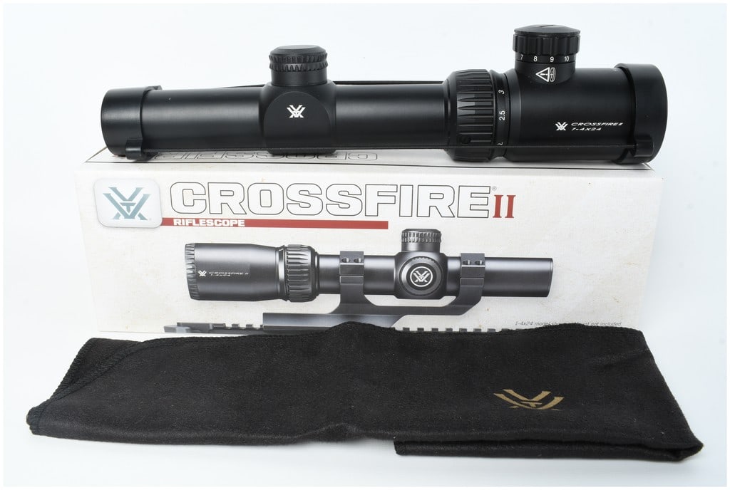 Vortex Crossfire II Rifle Scope 1-4x24 with V-Brite Reticle and Original Box: This lot features a modern Vortex Crossfire II rifle scope 1-4x24, model CF2-31037, constructed with a black matte-finished aluminum body. The scope is clearly marked with the manufacturer's stylized 
