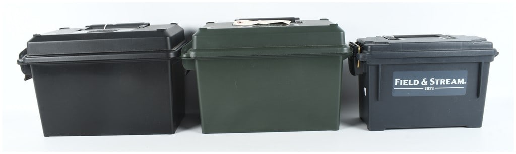 Three MTM Case-Gard and Field & Stream Plastic Ammunition Cans: This lot consists of three durable polymer ammunition storage containers of varying sizes and manufacturers designed for bulk storage and field use. The collection includes two large-capacity cans, on