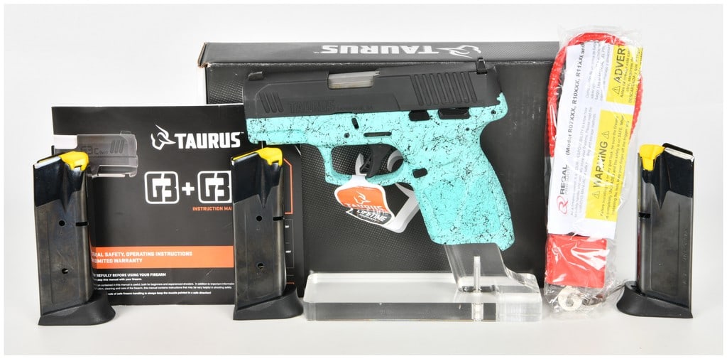 Taurus G3c Semi-Automatic Pistol 9mm with 3.26 Inch Barrel: This semi-automatic pistol is a Taurus G3c chambered in 9mm with a 3.26 inch barrel. The firearm features a black matte finished steel slide with rear and forward cocking serrations paired with a cyan