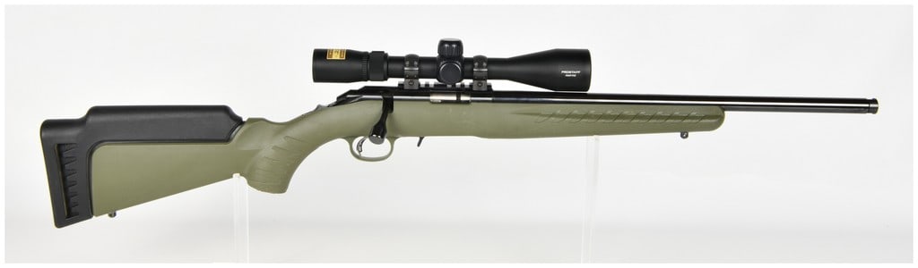 Ruger American Bolt Action Rifle .22 WMR with 22 Inch Barrel: This is a Ruger American bolt-action rifle chambered in .22 WMR. The firearm features a 22-inch blued barrel with a threaded muzzle and thread protector. The receiver is fitted with a Picatinny-style 