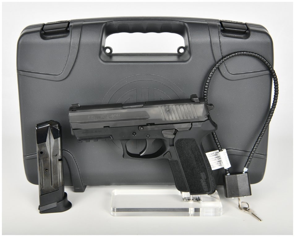 Sig Sauer SP2022 Semi-Automatic Pistol 9mm with 3.9 Inch Barrel: This is a Sig Sauer model SP2022 semi-automatic pistol chambered in 9mm x 19, designed as a polymer-framed firearm in a California-compliant configuration. The pistol features a 3.9 inch barrel and a 