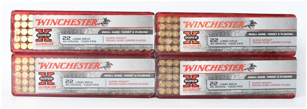 A Lot of 400 Rounds of Winchester Super-X Super Speed .22 Long Rifle Ammunition: This lot consists of 400 rounds of Winchester Super-X Super Speed rimfire ammunition chambered in .22 Long Rifle. The ammunition is contained within four translucent red plastic slide-top boxes, with 