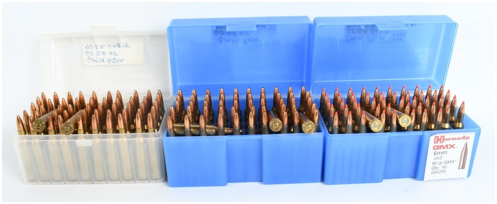 A Lot of 155 Live Rounds of 6mm Remington Ammunition: This lot consists of 155 live rounds of 6mm Remington caliber centerfire rifle ammunition, organized into three individual plastic storage containers. Based on the accompanying handwritten labels, the