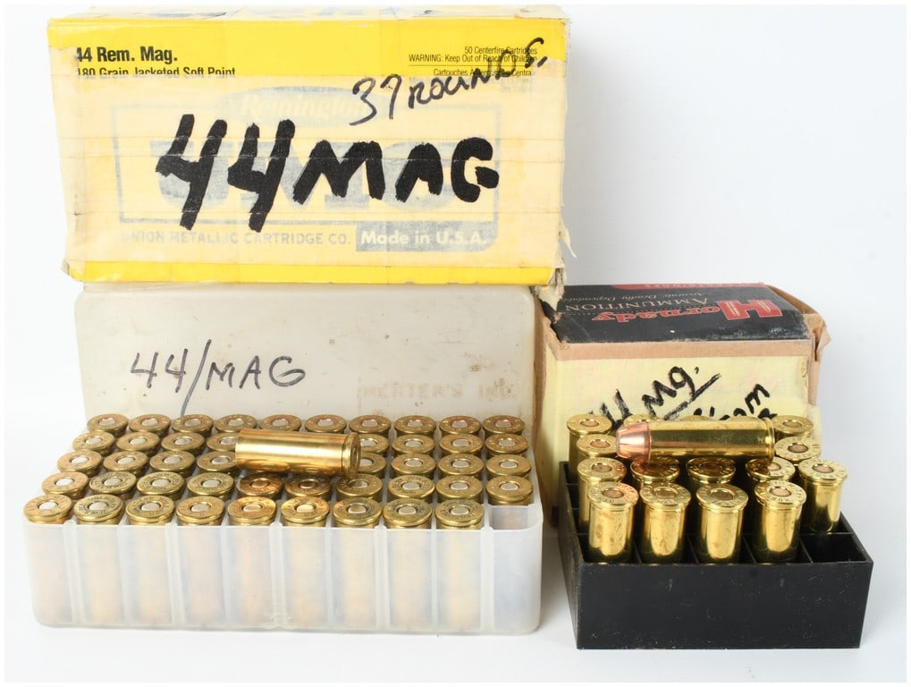 A Collection of 57 Live Rounds and 50 Empty Brass Casings of .44 Remington Magnum Ammunition: This lot consists of a collection of 57 live rounds and 50 empty brass casings of .44 Remington Magnum ammunition organized across three separate containers. Included is a vintage yellow Remington box