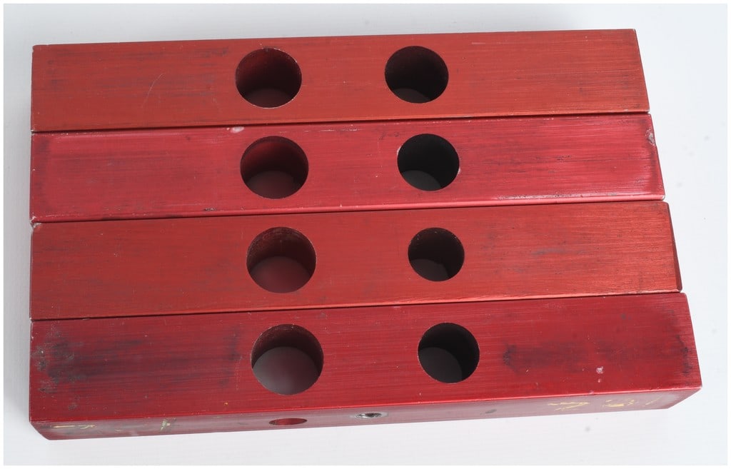 Four MEC 302 Series Charge Bars for Single Stage Reloading Presses: A set of four MEC 302 series charge bars constructed from rectangular aluminum bar stock with a red anodized finish. Designed for use in single stage shotshell reloading presses, these bars feature tw