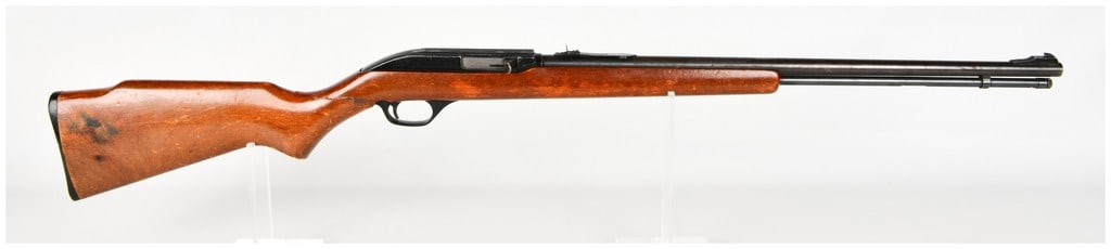 Marlin Model 60 Semi-Automatic Rifle .22 LR with 22 Inch Barrel: This Marlin Model 60 is a semi-automatic rifle chambered in .22 Long Rifle, featuring a 22-inch Micro-Groove barrel and a full-length under-barrel tubular magazine. The rifle is equipped with a black-