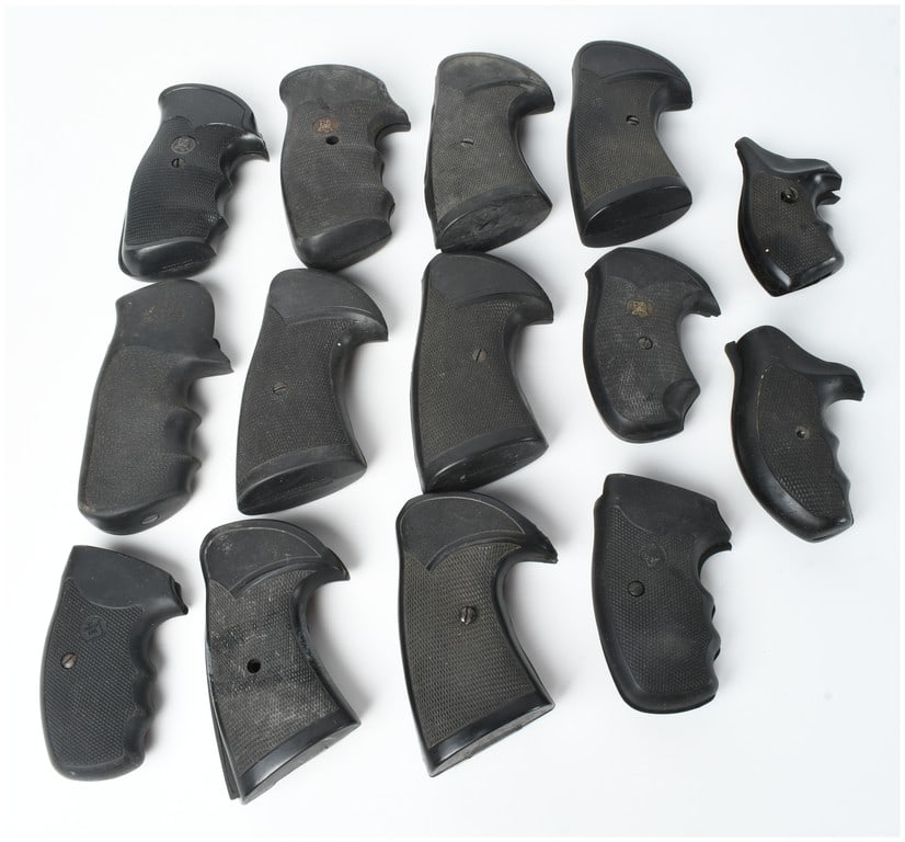 A Collection of 14 Assorted Rubber Revolver Pistol Grips: This lot consists of a collection of 14 assorted black rubber and polymer revolver pistol grips manufactured by various companies. The majority of the lot is comprised of Pachmayr grips, including