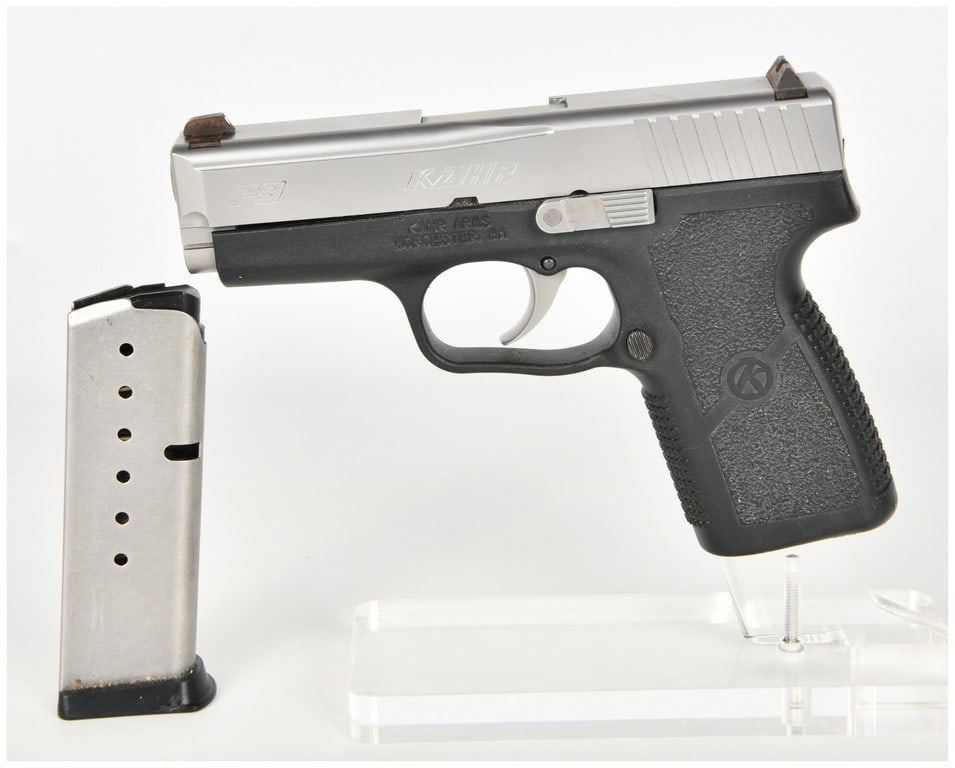 Kahr Arms P9 Semi-Automatic Pistol 9mm with 3.5 Inch Barrel: This Kahr Arms P9 is a compact semi-automatic pistol chambered in 9mm, featuring a 3.5 inch barrel and a matte stainless steel slide. The frame is constructed of black polymer with integrated textured