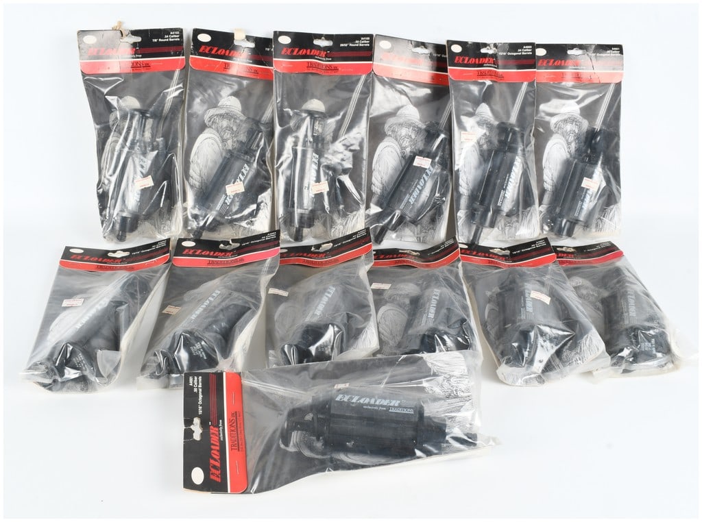 A Collection of 12 Traditions Inc. EZLOADER Muzzleloading Speed Loaders: A collection of 12 Traditions Inc. EZLOADER muzzleloading speed loader accessories, new old stock in their original retail packaging. These black synthetic devices are designed for use with .50 and .5