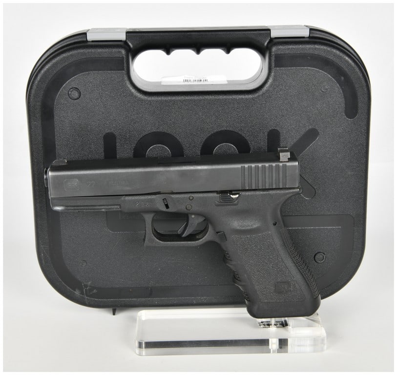 Glock Model 22 Semi-Automatic Pistol .40 S&W with 4.49 Inch Barrel: This lot features a Glock Model 22 semi-automatic pistol chambered in .40 S&W. The pistol is equipped with a 4.49-inch barrel and features a matte black finished slide on a black polymer frame with in