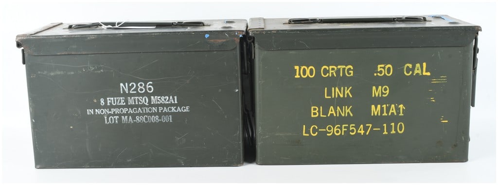 A Pair of US Military Surplus M2A1 Steel Ammunition Cans: This lot consists of two US military surplus M2A1 steel ammunition cans, used for the storage and transport of various types of ordnance. Both containers are constructed of heavy-gauge steel with an o