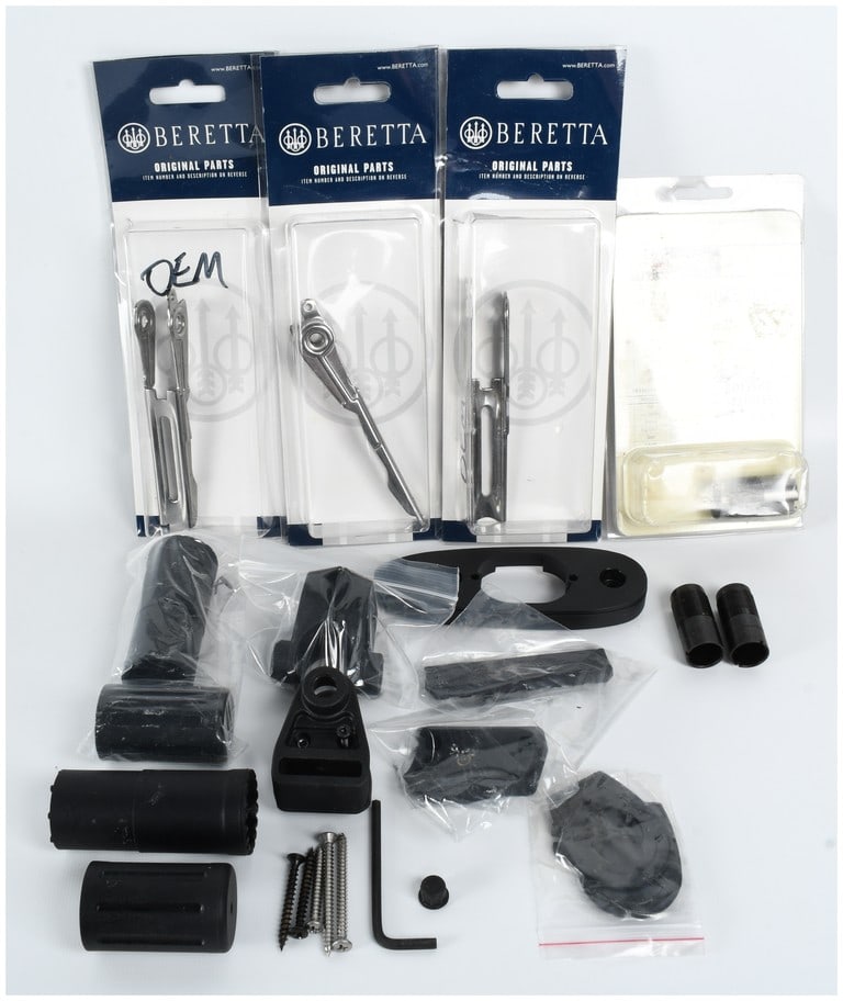 A Collection of Assorted Shotgun Parts and Accessories Including Beretta and Browning: This lot consists of a collection of assorted shotgun parts and accessories from Beretta and Browning. Included are three Beretta Original Parts in their factory blister packaging, featuring internal 