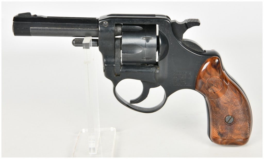 RG Industries Model RG 14 Double Action Revolver .22 LR with 3 Inch Barrel: This is an RG Industries Model RG 14 double-action revolver chambered in .22 Long Rifle. The firearm is equipped with an approximately 3 inch barrel featuring a solid top rib and fixed front and rear 