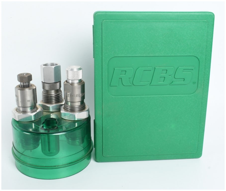 Two Reloading Die Sets by RCBS and Lee: This lot comprises two die sets for ammunition reloading. The first set is an RCBS full-length two-die set for .30 Mauser, contained in its original green plastic storage case. The set includes a full